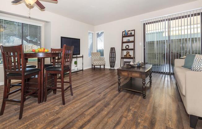 a living room filled with furniture and a large window