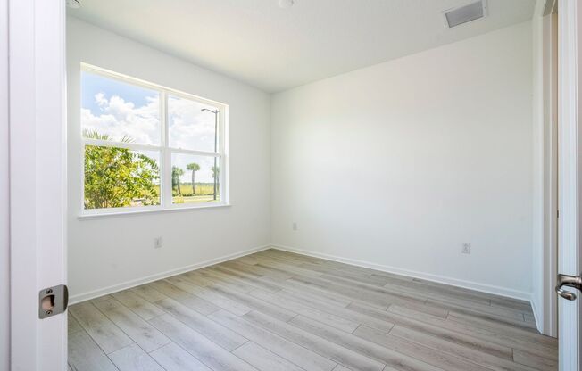 Modern 3-Bedroom 3.5-Bath Townhome with EV Charger, Smart Home Features, 2-Car Garage & Resort-Style Amenities in Lake Nona!