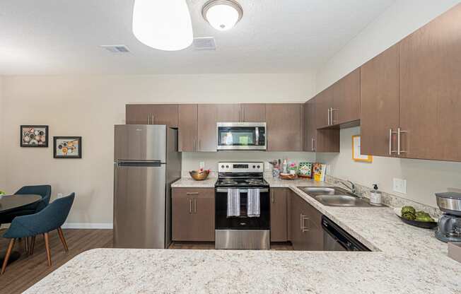 a kitchen with stainless steel appliances and granite counter tops