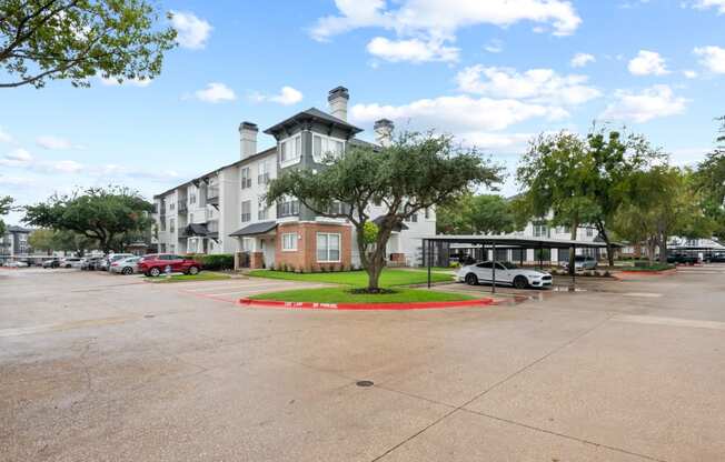 an empty parking lot in front of an apartment building at Mission Gate, Texas