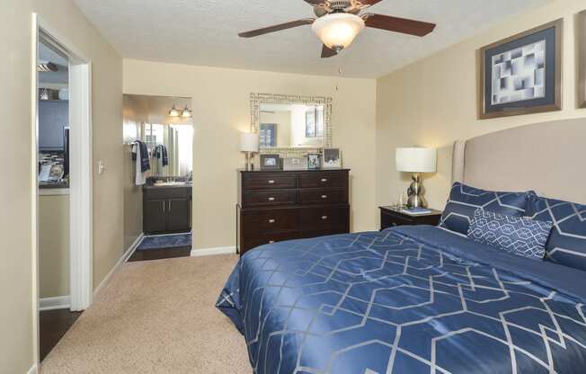 Bedroom with cozy bed1at Harvard Place Apartment Homes by ICER, Lithonia, GA