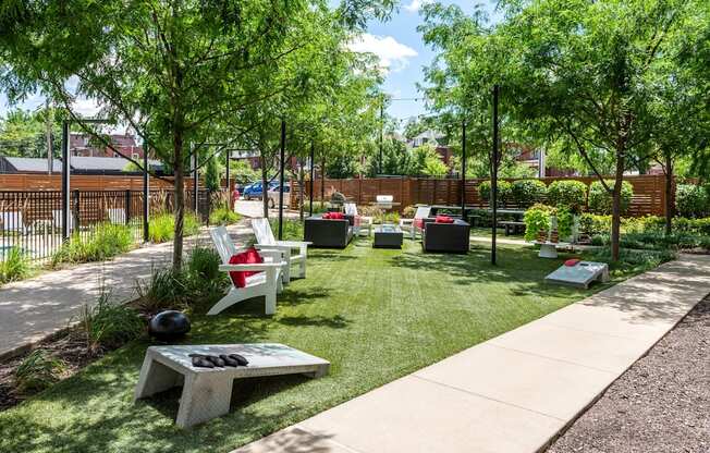 a courtyard with benches and grass and trees at Grand Flats, Missouri