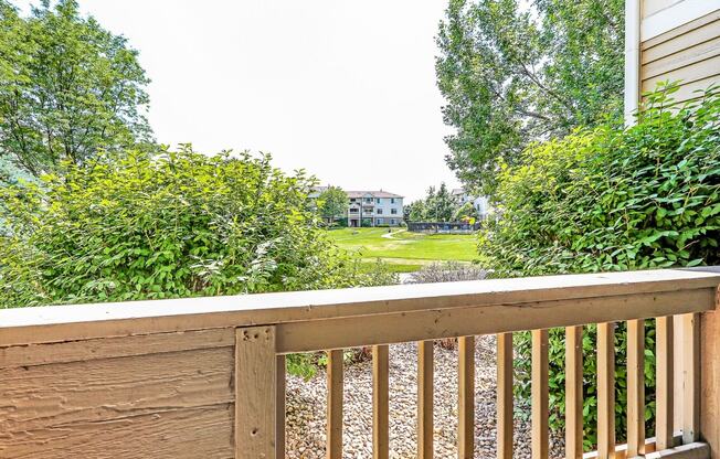 Courtyard Views From Private Patio with Wood Railing