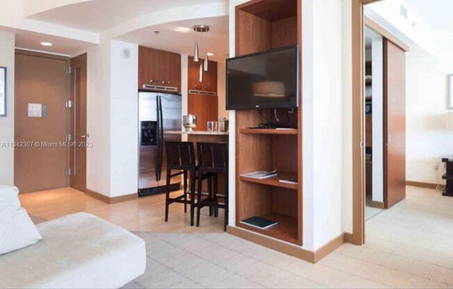 Experience luxury living in this bright and spacious 1-bedroom, 1-bathroom residence, featuring a large balcony and in-unit washer/dryer. Enjoy resort-style amenities, fitness center, pool, and more. Residents also benefit from hotel-like services and inc