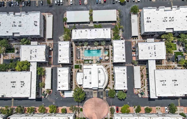 arial view of buildings with a pool in the middle