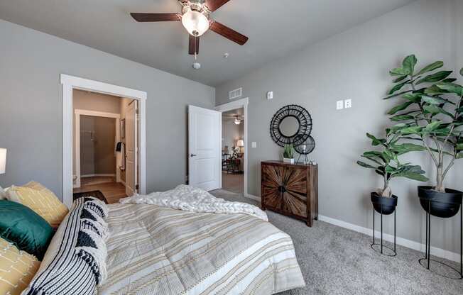 Pelican primary bedroom with bathroom and living room view