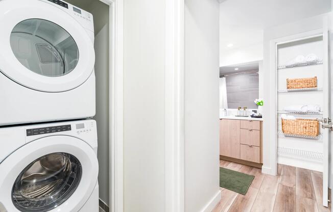 In-home laundry with built-in shelving keeps daily routines simple and organized—designed for the way residents live at Modera Aventura.