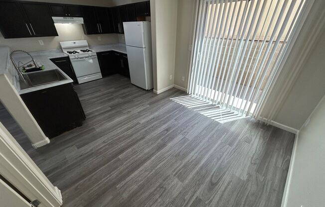 BEAUTIFUL 2 BEDROOM, 2.5 BATHROOM HOME WITH AN ATTACHED GARAGE LOCATED IN A WELL-MAINTAINED COMMUNITY