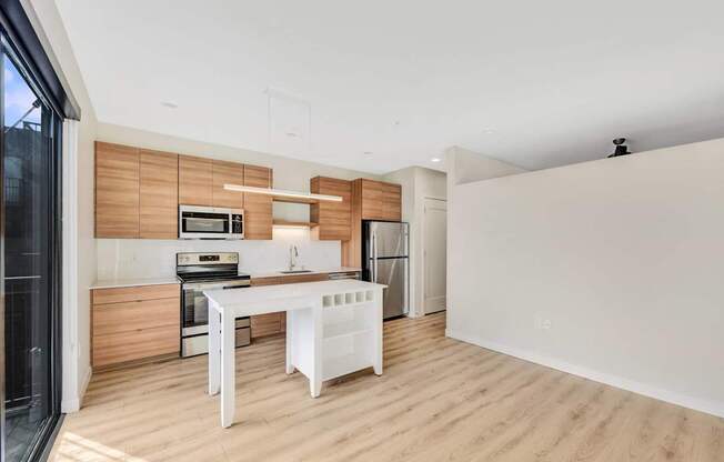 A modern kitchen with wooden accents and white appliances.
