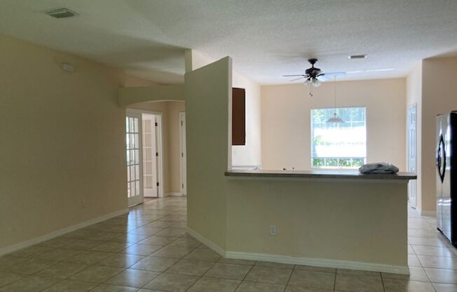 Spacious 4/2/2 Home with Screened-In Porch and Stylish Finishes