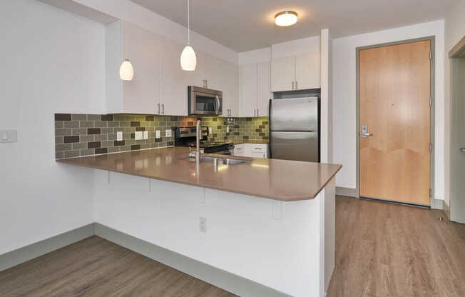 Kitchen with Stainless Steel Appliances and Breakfast Bar