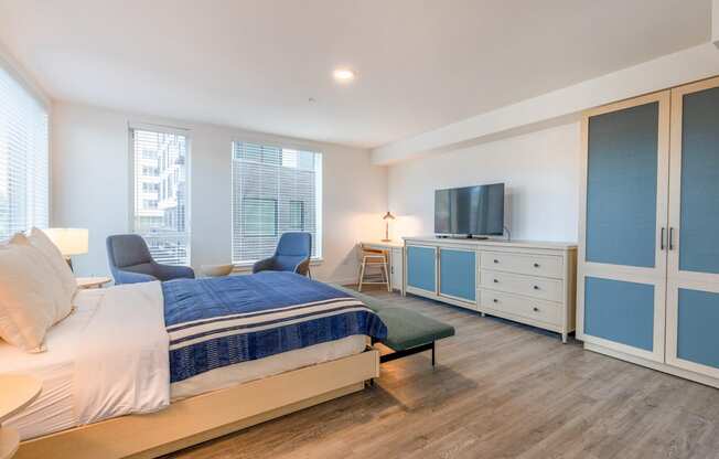 a bedroom with a bed and a television at Marina Square, Bremerton, WA