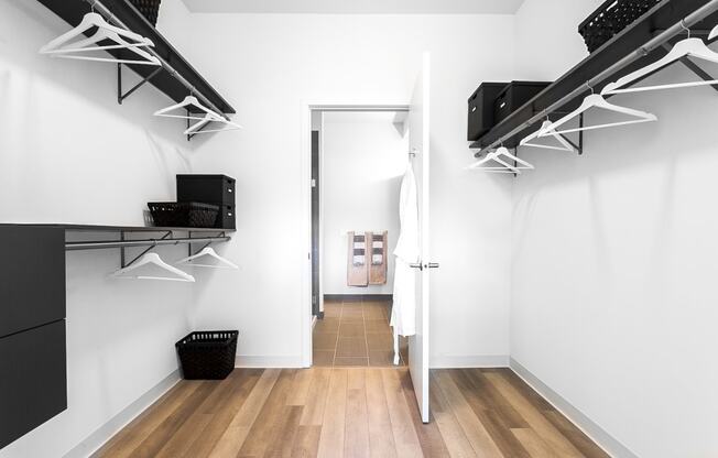 Closet at L Logan Square Apartments, providing ample storage space for clothing and accessories, ensuring a clutter-free and well-organized living environment.