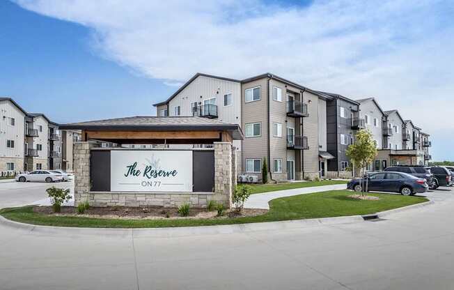 The Reserve ON77 is a modern apartment complex with a clean and well-maintained exterior.
