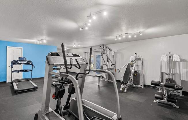 a gym with weights and cardio equipment at the enclave at woodbury