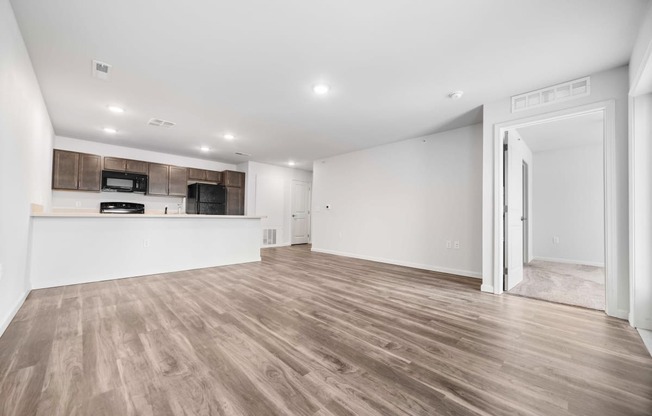 the living room and kitchen in a 555 waverly unit  at Union at Wiley, Cedar Rapids, 52404