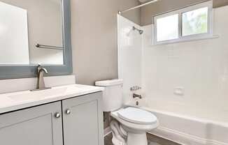 an empty bathroom with a toilet and a sink