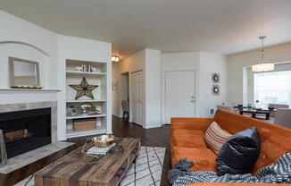 Village at Main Street | Living Room  with Built In Shelving and Fireplace