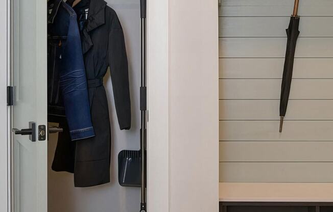 Cozy entryway foyer with hall closet and coat hooks at Novel Cary