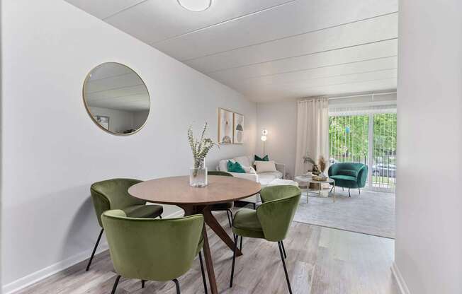 a dining room with a table and chairs