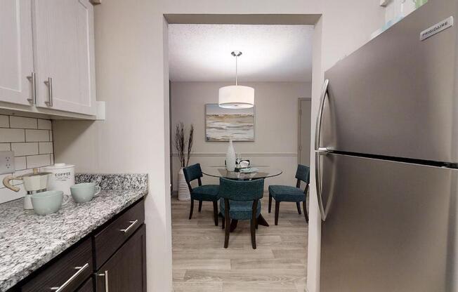 Kitchen with granite countertops and stainless steel appliances at The Madison Franklin, Tennessee, 37064