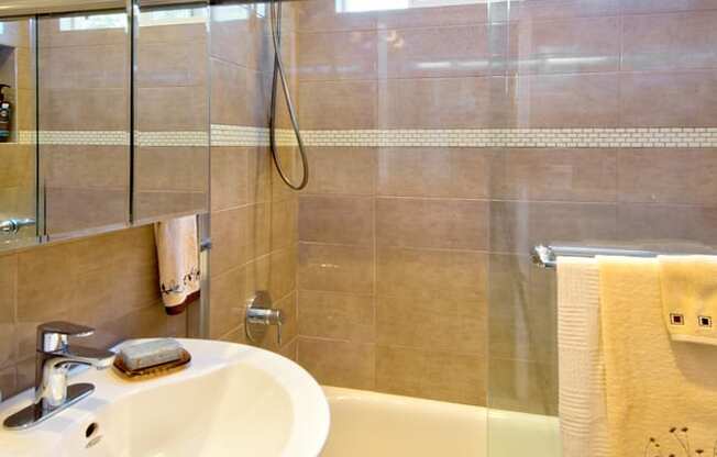 Apartment bathroom with vanity and shower tub combo