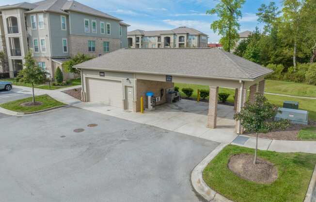 a large parking lot with a garage and a house