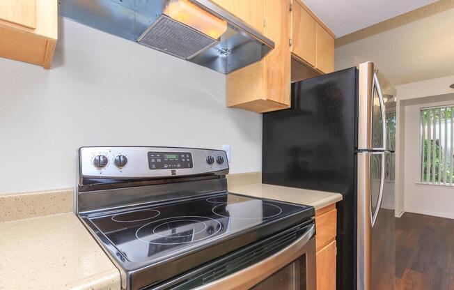 a stove top oven sitting inside of a kitchen