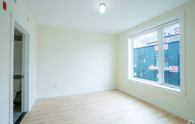 A room with a window overlooking a cityscape. at 603 Concord Apartments, Cambridge, MA, 02138