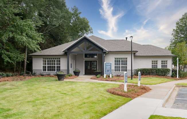 the front of a white house with a lawn and sidewalk at Twenty35 at Timothy Woods, Athens, GA