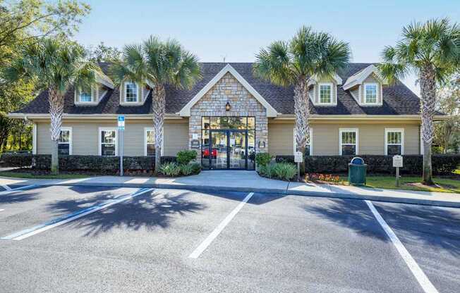 A building with a parking lot in front of it.