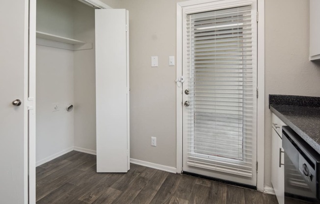 Laundry Closet in Kitchen at Preston Villas Apartment Homes, Dallas, Texas, TX