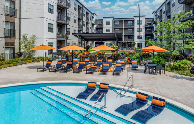 our apartments have a large pool with chairs and umbrellas