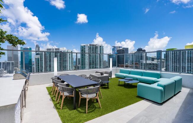 Dine and unwind with panoramic skyline views at Modera Riverside’s rooftop outdoor lounge.