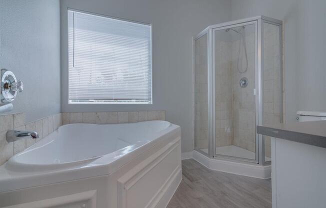 a white bathroom with a tub and a shower at Warner Center Townhomes, Canoga Park, 91303 