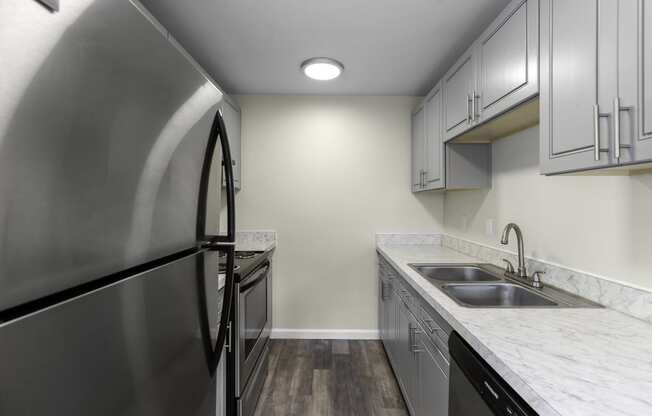 interior kitchen with stainless steel appliances at Swiss Gables Apartment Homes, Kent