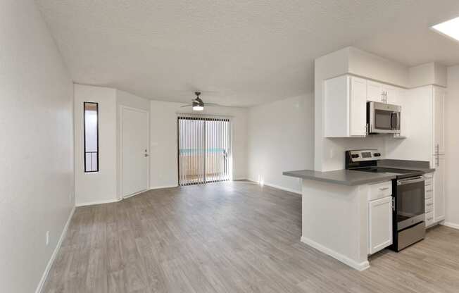 apartment living room with view of balcony at Paseo 51, Glendale, Arizona