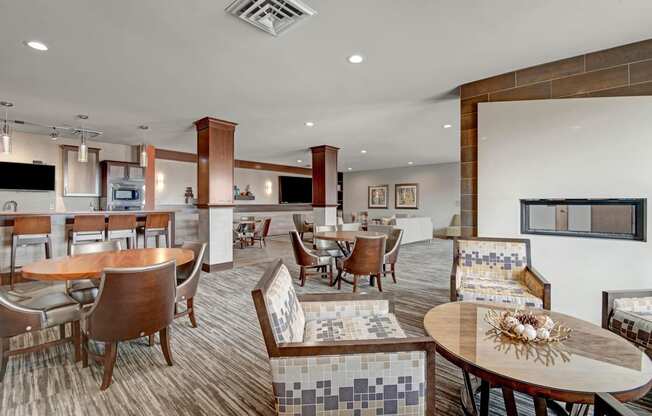 The Clubhouse at The Vue at Pinnacle Peak Apartment Homes Apartments in Fitchburg, WIed with furniture and a large window