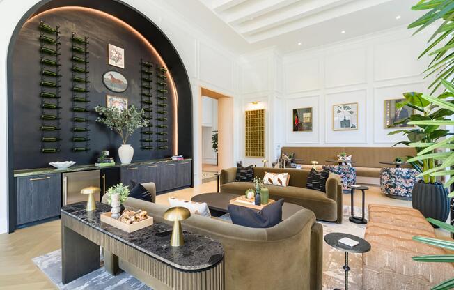 Resident lounge with arched wine display, tailored seating, and refined finishes reflecting Nashville’s creative neighborhoods nearby.