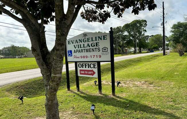 a sign that reads evangeline village apartments