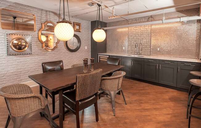 A dining room with a wooden table and chairs.