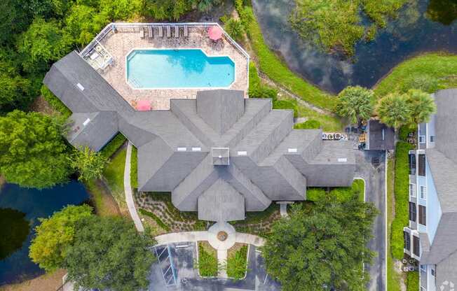 A large house with a pool in the backyard.