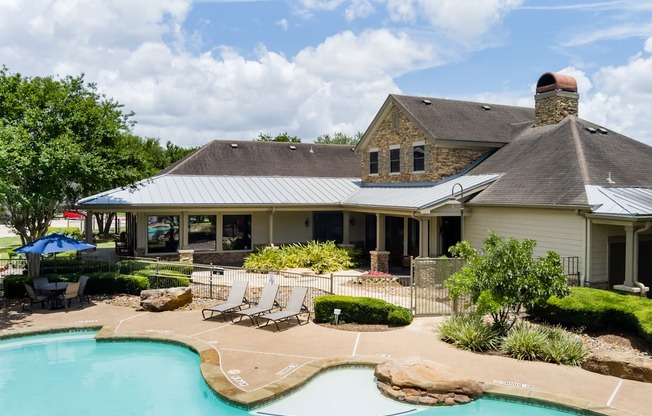 A house with a pool in the backyard.