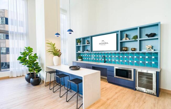 Bright and inviting resident kitchen at Modera Riverside, designed for gatherings with a touch of Miami flair.