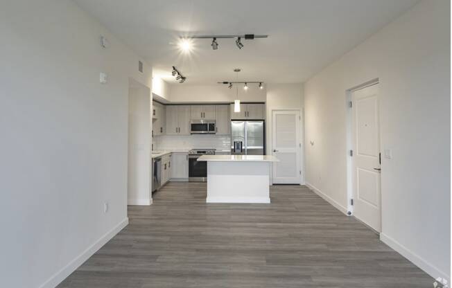 a kitchen and living room in a 555 waverly unit