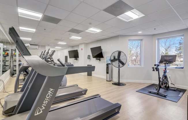 24/7 Fitness Center with Cardio Equipment, Free Weights, and Strength Training.