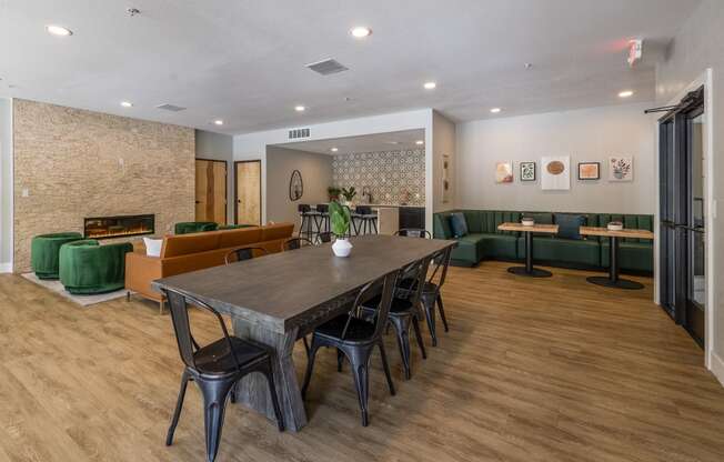 a dining room with a large table and chairs