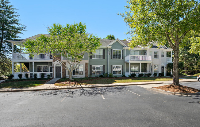 Exterior with Lush Landscaping and large patios located at St. Andrews Apartments in Johns Creek, GA 30022