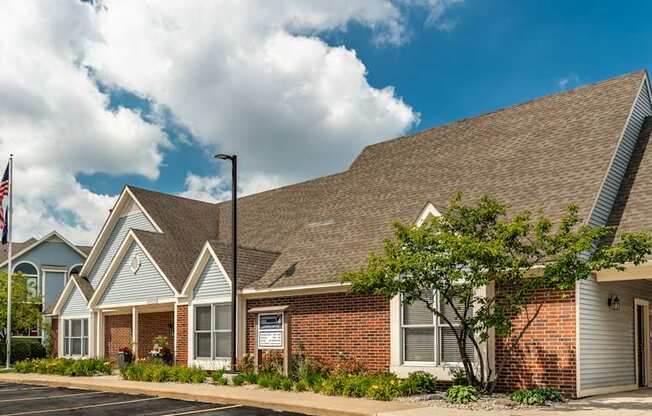 A row of houses with a flag on the left