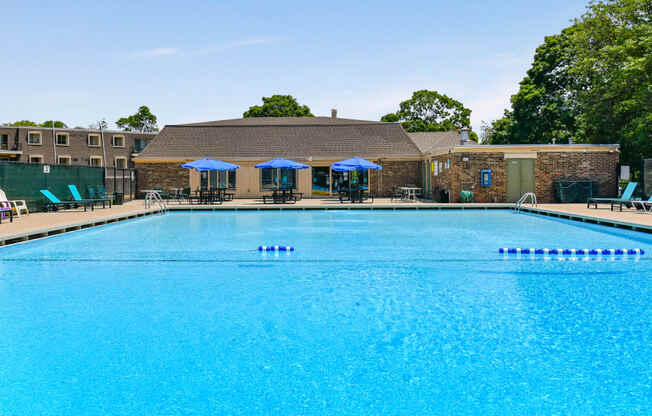Crystal clear swimming pool with new renovated seating and lounge area at Aspen Ridge Apartments in West Chicago Illinois 60185